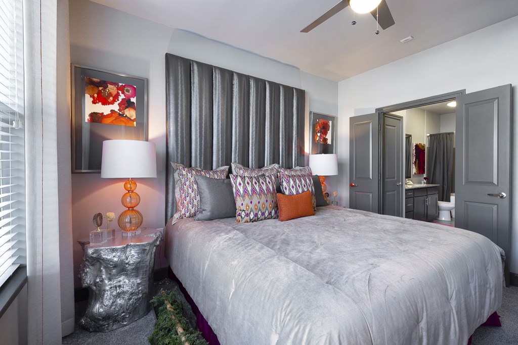 a bedroom with a large bed and a mirror at North Creek, Hutto, 78634