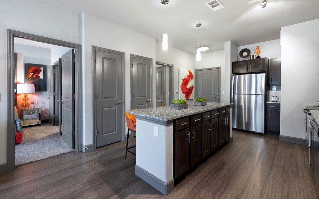 a kitchen with a large island in the middle of it at North Creek, Texas