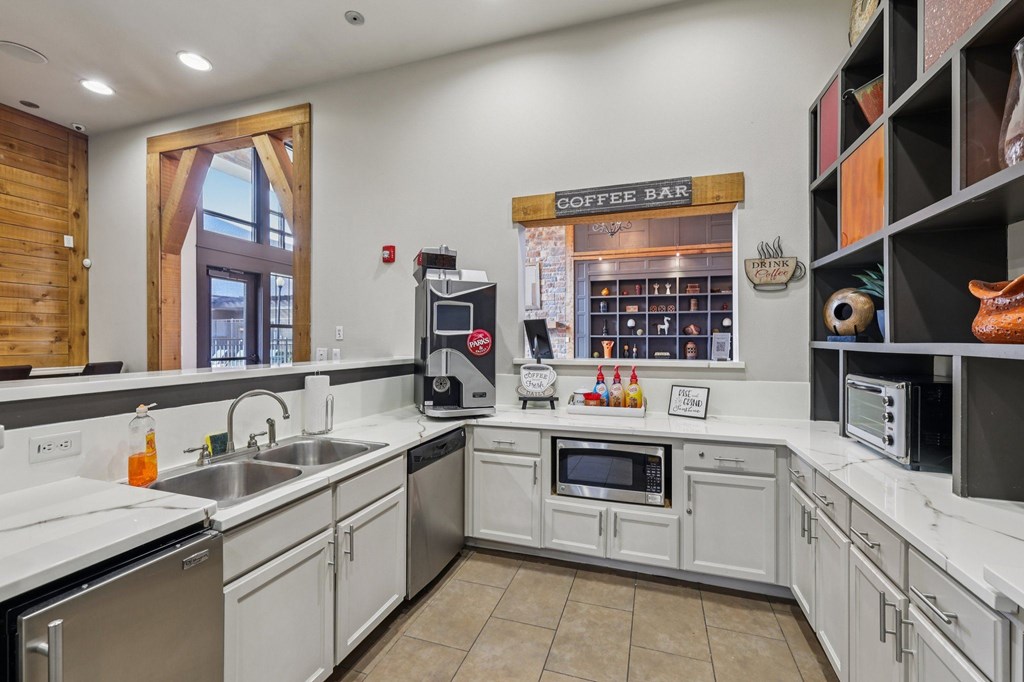 A coffee bar is located in the corner of a modern kitchen.