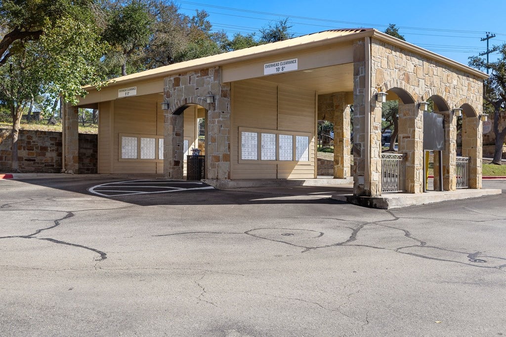the front of a gas station in a parking lot at The Verandah, Austin, 78726