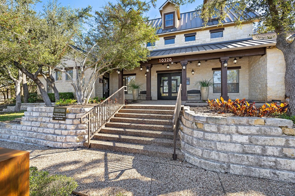 the front of a building with stone steps and a staircase at Sonterra Apartment Homes, Austin, Texas
