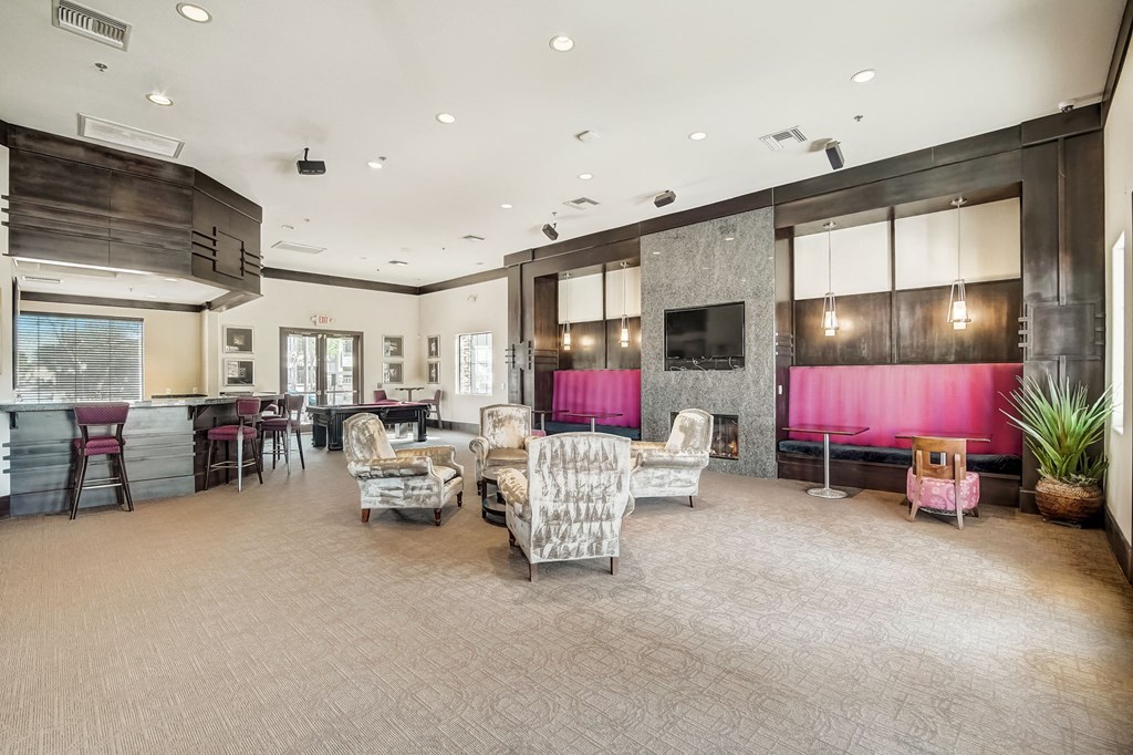 a living room with couches and chairs and a kitchen with a television  at Adiamo Palm Valley, Arizona