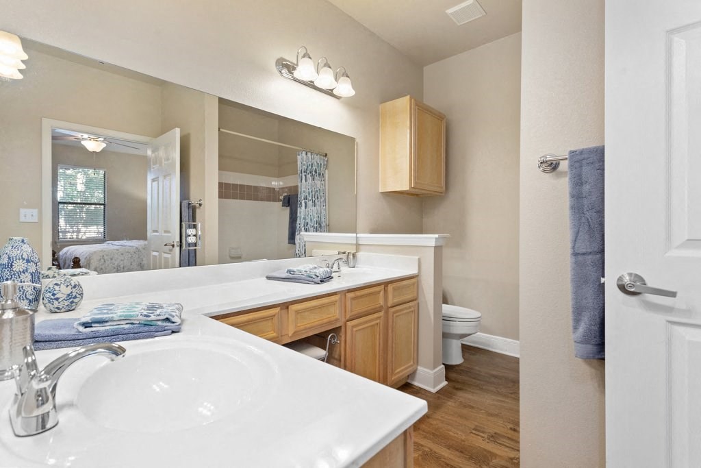 a bathroom with a sink and a toilet at The Verandah, Austin, 78726