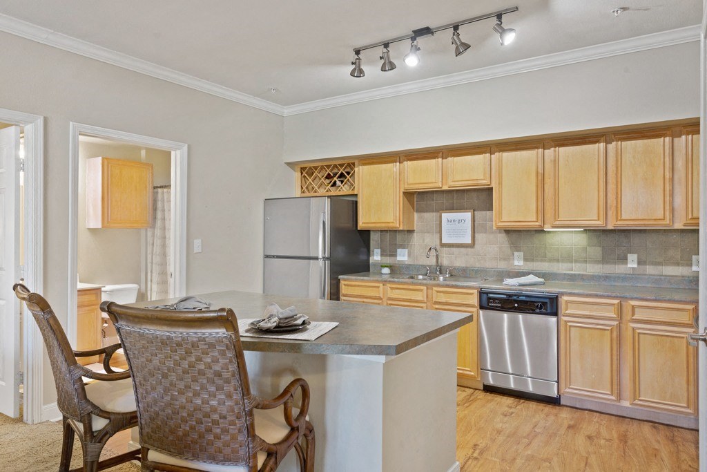 a kitchen and dining area in a 555 waverly unit at The Verandah, Texas