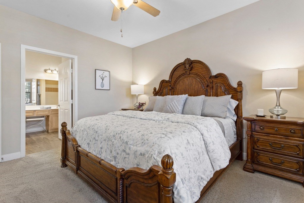 a bedroom with a large bed and two night stands at The Verandah, Austin, 78726