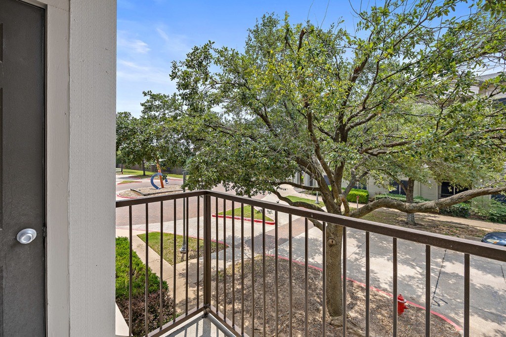 balcony with tree views at Artisan Apartments & Shops, Texas, 78729