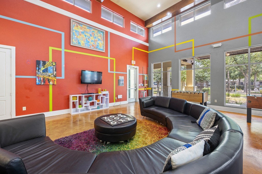 Resident Clubhouse with Sofa at Artisan Apartments & Shops, Austin, Texas