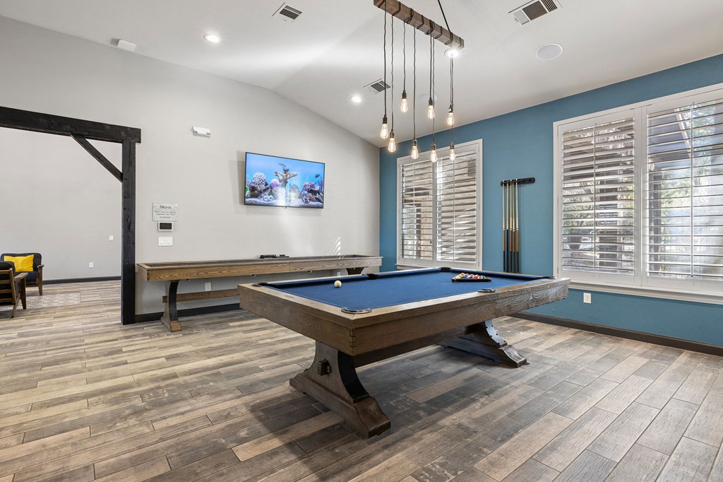 a games room with a pool table and a tv at Sonterra Apartment Homes, Austin, TX