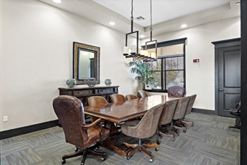 a conference room with a large table and chairs - Photo Gallery 18