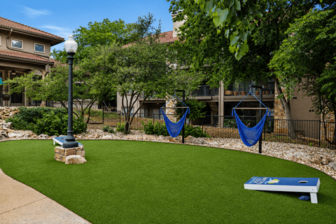 A small park with a bench and a playground.