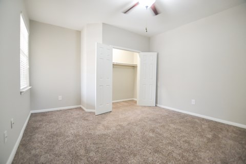 Spacious open concept bedroom with natural light and large closet at The Legends at Eagle Mountain Lake, Fort Worth, TX