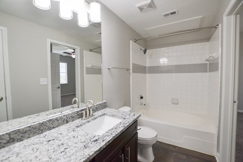 upgraded bathroom with granite countertops, oversized garden tub at The Legends at Eagle Mountain Lake, Fort Worth, TX