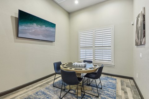 Dining room with round table and modern chairs at Sonterra Apartments Homes, Austin, TX 78726