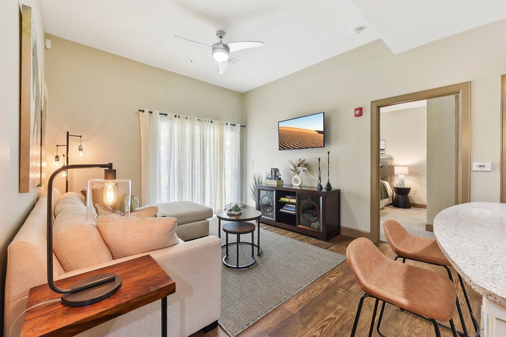 a living room with a couch and a table at Lakeline East Apartments, Cedar Park, 78613