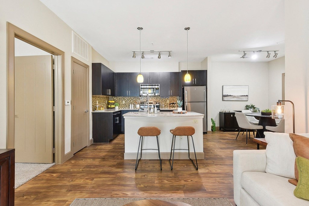 a view of a living room and kitchen with an open floor plan  at Lakeline East Apartments, Cedar Park, TX, 78613