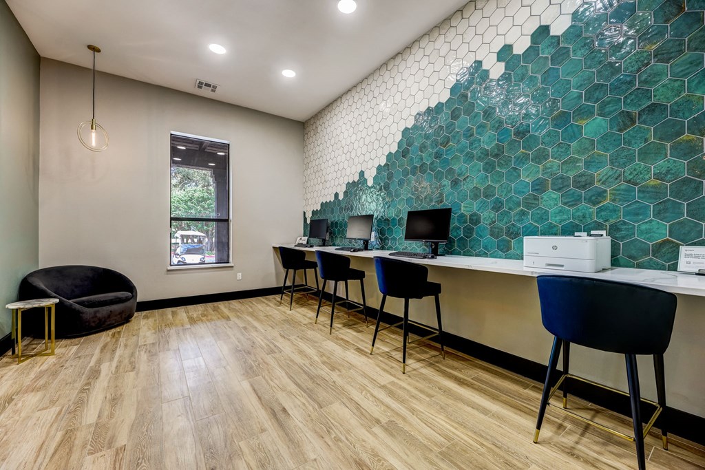 an office with desks and chairs and a wall with green tiles at Ventana Oaks Apartments, Austin, 78717