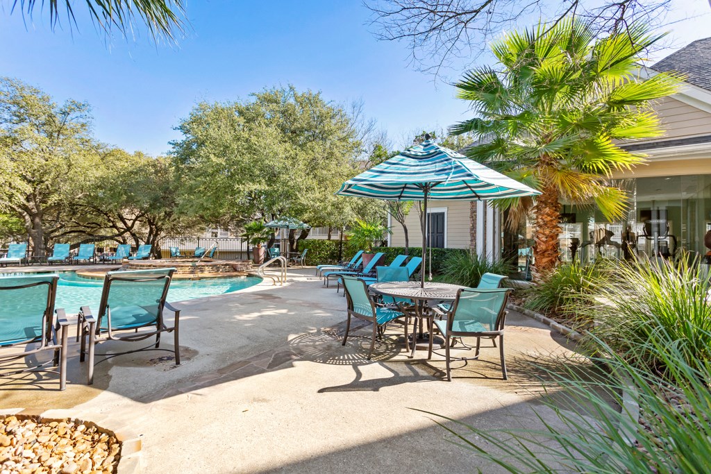 Umbrella Shaded Chairs By Pool  at Stone Oak @ Parmer, Austin, Texas