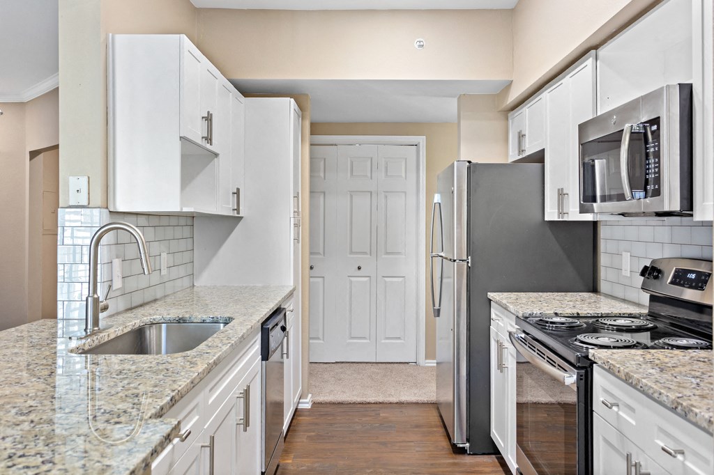 Kitchen With Custom Cabinetry  at Stone Oak @ Parmer, Austin, Texas