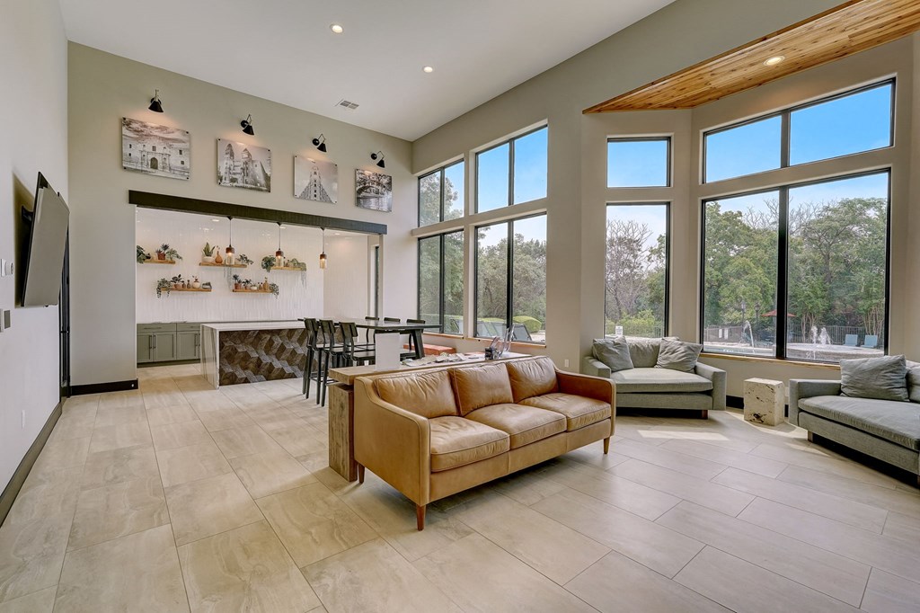 the living room is open to the dining room and kitchen