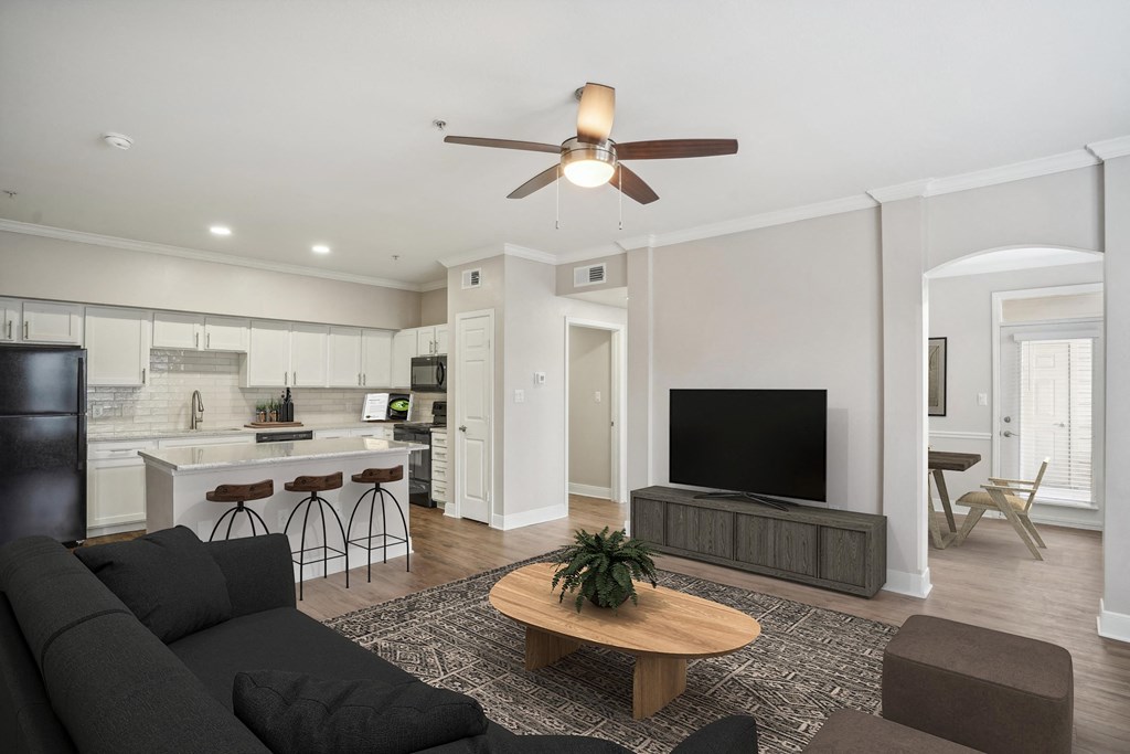 a living room with a couch and a tv at The Verandah, Texas, 78726