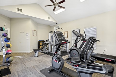 the gym with plenty of cardio equipment at the at the grove apartments