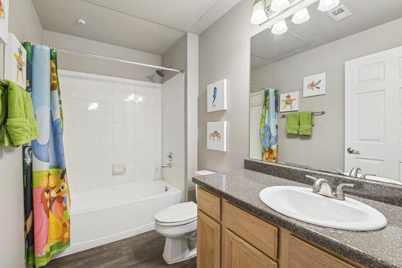 a bathroom with a sink toilet and a shower at Legends on the Green Apartments, Texas, 78232
