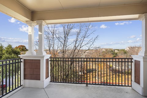 the view from the front porch of a home with a balcony and a fence at The Legends at Eagle Mountain Lake, Fort Worth, TX