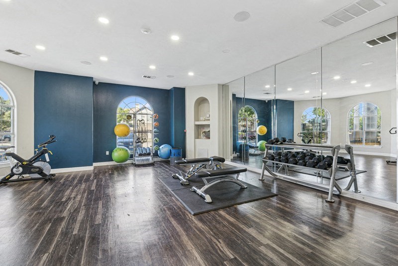 the estates with weights and mirrors at TalaVera Apartments, Texas