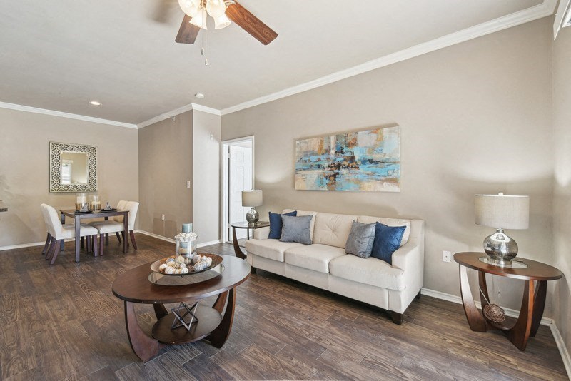a living room with a couch and a table at Legends on the Green Apartments, San Antonio, Texas
