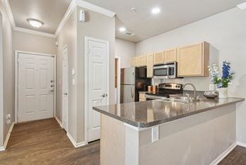 a kitchen with a granite counter top and a