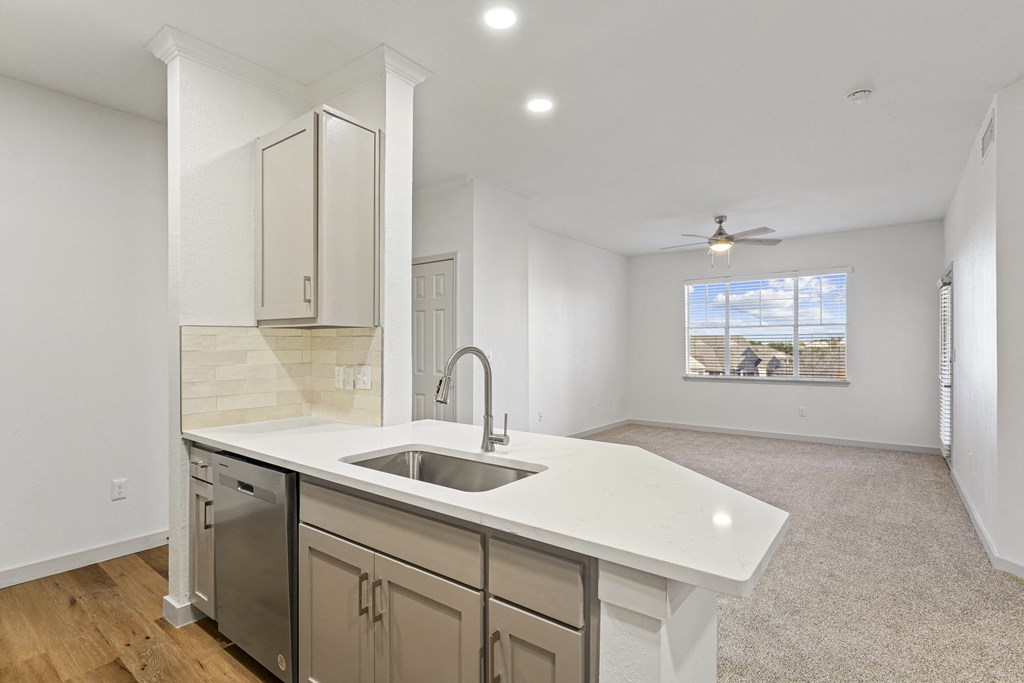 an empty kitchen with a sink and a window at The Legends at Eagle Mountain Lake, Texas, 76179