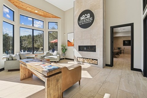 a living room with a fireplace and a wooden table