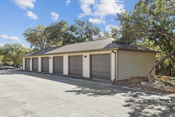a garage with four roll up garage doors
