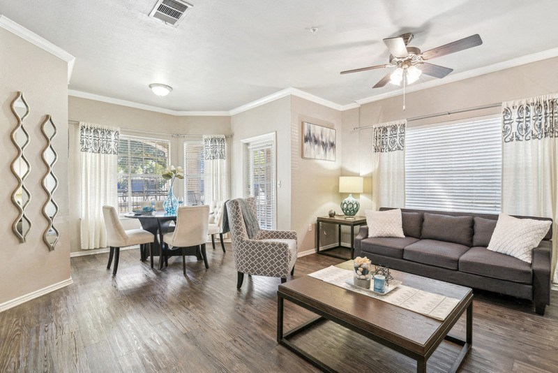 a living room with a couch and a table at TalaVera Apartments, Texas
