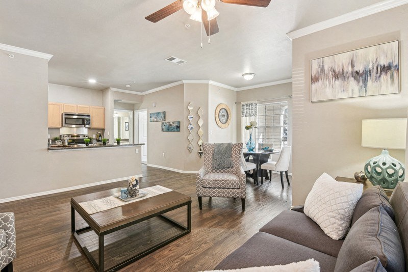 a living room with a couch and a table at TalaVera Apartments, San Antonio, TX, 78232
