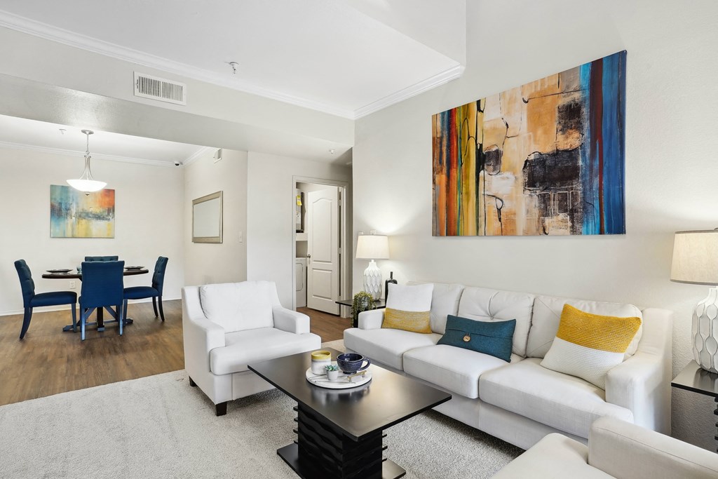 a living room with a couch and a coffee table at La Ventura Apartments, Texas, 75093