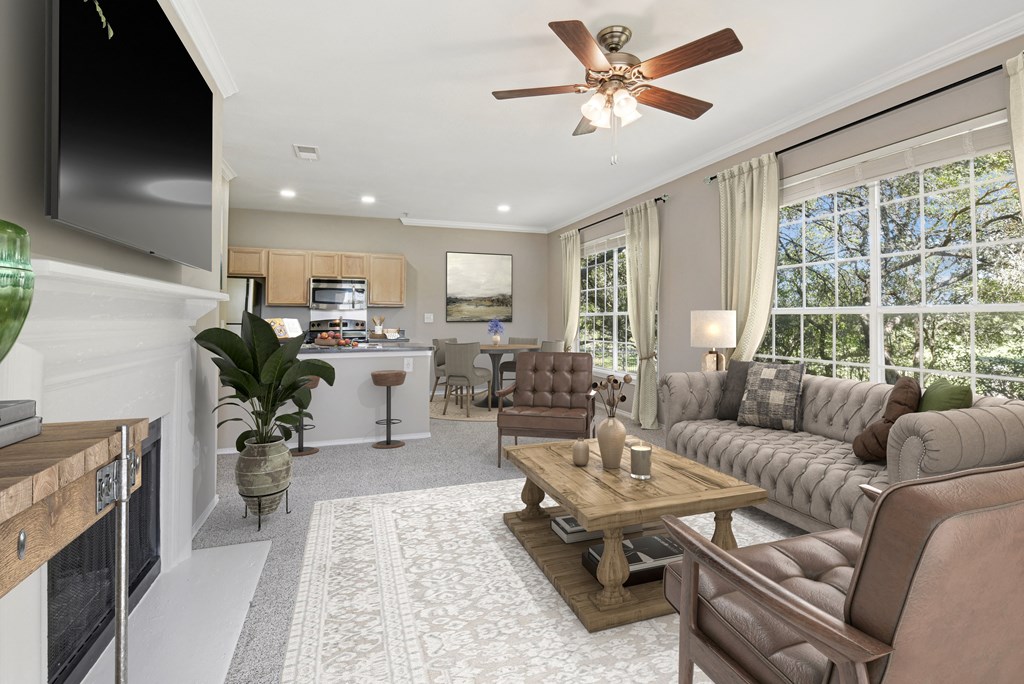a living room with a couch and a table at Legends on the Green Apartments, San Antonio