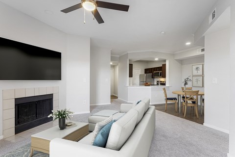 a living room with a couch and a fireplace at The Legends at Eagle Mountain Lake, Fort Worth, Texas