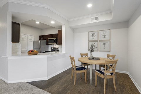 an open kitchen and dining area with a table and chairs at The Legends at Eagle Mountain Lake, Fort Worth, Texas