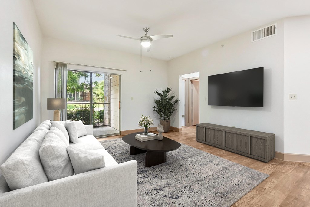 a living room with a couch and a tv at Lakeline East Apartments, Cedar Park, 78613