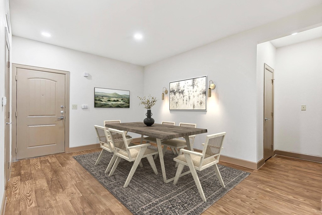 a dining room with a wooden table and chairs  at Lakeline East Apartments, Cedar Park, TX, 78613