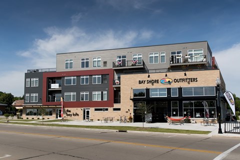 A building with a Bay Shore Outfitters storefront.