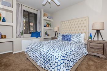 a bedroom with a bed and a window at The Preserve by Picerne, N Las Vegas, NV