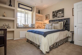 a bedroom with a bed and a window at The Passage by Picerne, Henderson, NV