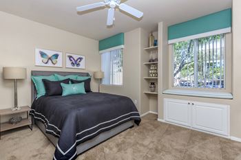 a bedroom with a bed and a ceiling fan at The Covington by Picerne, Las Vegas, NV, 89139