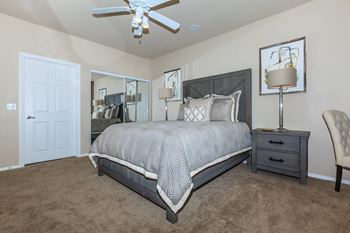 a bedroom with a bed and a ceiling fan at The Preserve by Picerne, N Las Vegas, NV