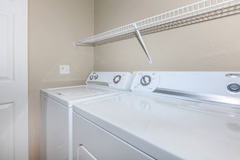 a washer and dryer in the laundry room of a house at The Preserve by Picerne, N Las Vegas, NV