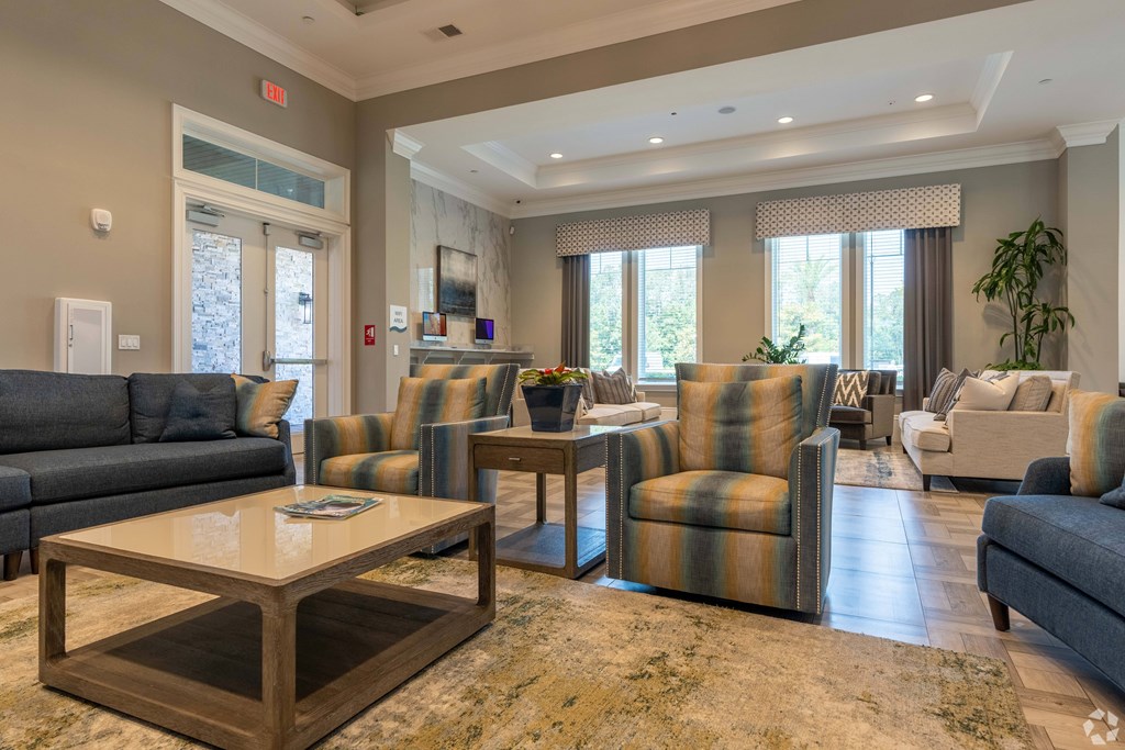 A living room with a grey couch and a coffee table.