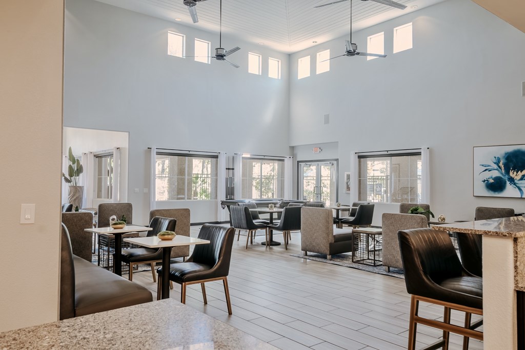 Large open and bright clubhouse with cafe style seating.