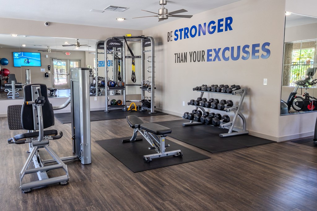 Fitness center with free weights and strength training equipment.